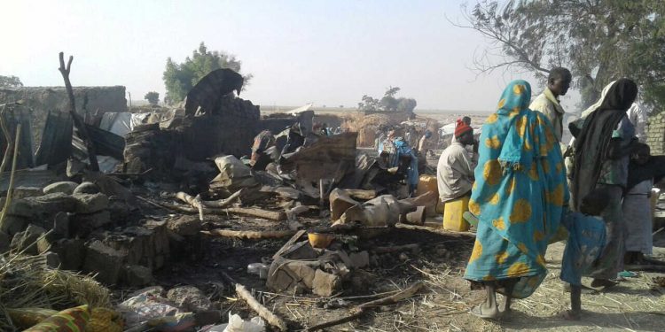 People walk at the site after a bombing attack of an internally displaced persons camp in Rann, Nigeria January 17, 2017.   MSF/Handout via Reuters       ATTENTION EDITORS - THIS IMAGE WAS PROVIDED BY A THIRD PARTY. EDITORIAL USE ONLY. NO RESALES. NO ARCHIVES.     TPX IMAGES OF THE DAY - RTSVYC5