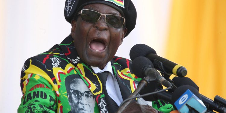 Zimbabwe's President Robert Mugabe delivers a speech during the Zimbabwe ruling party Zimbabwe African National Union- Patriotic Front (Zanu PF) youth interface Rally on November 4, 2017 in Bulawayo. / AFP PHOTO / ZINYANGE AUNTONY        (Photo credit should read ZINYANGE AUNTONY/AFP/Getty Images)