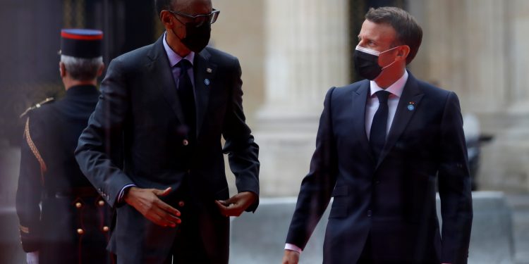 FILE PHOTO: French President Emmanuel Macron welcomes Rwanda's President Paul Kagame as he arrives to attend the International Conference in support of Sudan at the Temporary Grand Palais in Paris, France, May 17, 2021. REUTERS/Sarah Meyssonnier