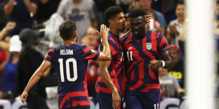 KANSAS CITY, KS - JULY 15: Daryl Dike #11 of the United States celebrates with his teammates after scoring their second goal during a Group B match between Martinique and United States as part of the 2021 CONCACAF Gold Cup at Children's Mercy Park on July 15, 2021 in Kansas City, Kansas. (Photo by Omar Vega/Getty Images)