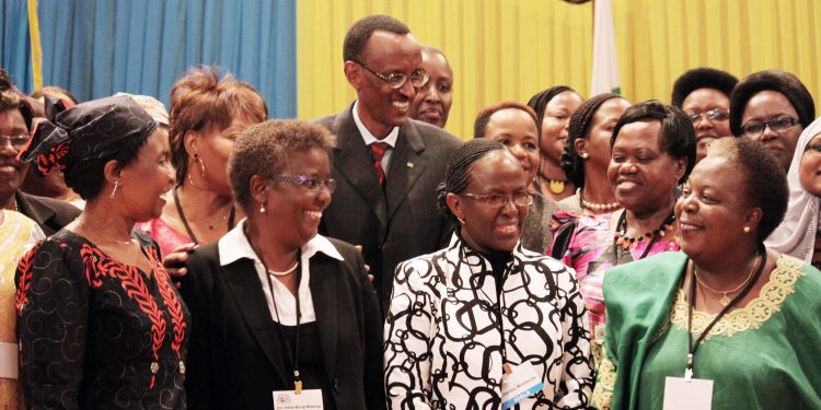 Rwandan President Paul Kagame (center) has been a proponent of putting women in positions of power. He's shown participating in a 2010 conference at the nation's Parliament to discuss the role of women.