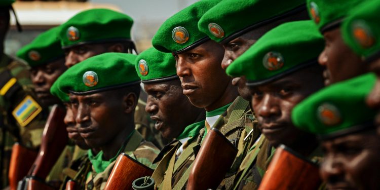 Rwandan soldiers stand in formation awaiting orders after being dropped off in the Central African Republic Jan. 19, 2014. U.S. forces will transport a total number of 850 Rwandan soldiers and more than 1,000 tons of equipment into the Central African Republic to aid French and African Union operations against militants during this three week-long operation. (U.S. Air Force photo/ Staff Sgt. Ryan Crane)