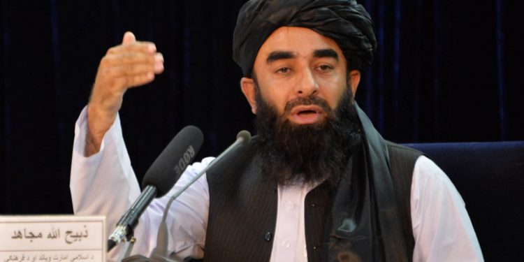 Taliban spokesperson Zabihullah Mujahid gestures as he speaks during a press conference in Kabul on August 24, 2021 after the Taliban stunning takeover of Afghanistan. (Photo by Hoshang Hashimi / AFP)