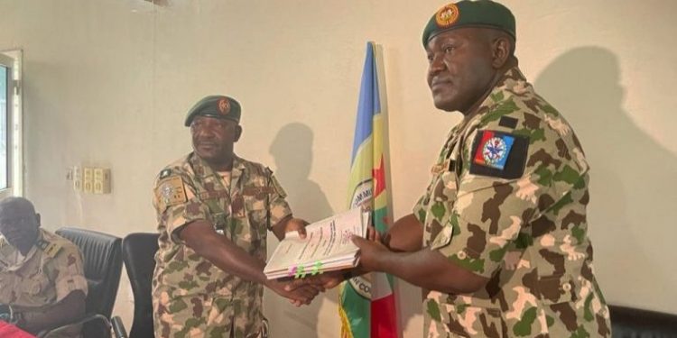 Maj. Gen. Ibrahim (right) takes over command of MNJTF.