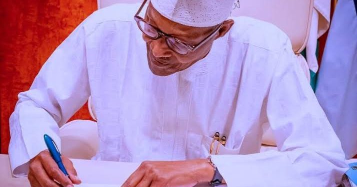 President Muhammadu Buhari signs PIB into law, August 16, 2021.