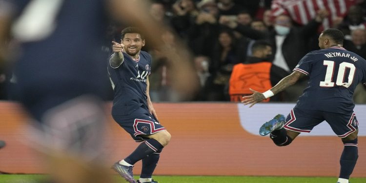 PSG's Lionel Messi celebrates after scoring his side's second goal during the Champions League Group A soccer match between Paris Saint-Germain and Manchester City at the Parc des Princes in Paris, Tuesday, Sept. 28, 2021. (AP Photo/Christophe Ena)