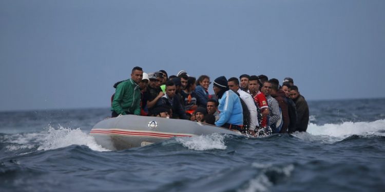 Picture of illegal migrants travelling on a boat used to illustrate the story