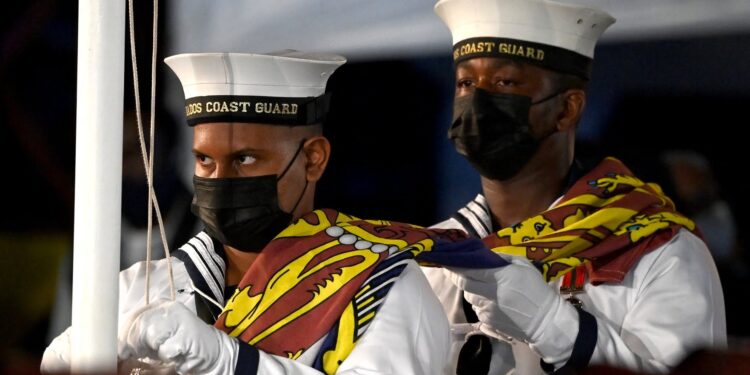 Barbados Coast Guard remove The Queen’s Royal Standard flag at the Presidential Inauguration Ceremony at Heroes Square in Bridgetown as Barbados officially became a Republic.