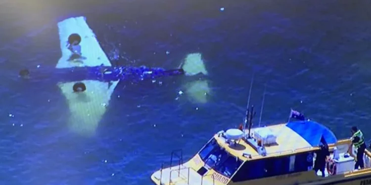 The coastguard at the scene of the semi-submerged plane on Sunday.