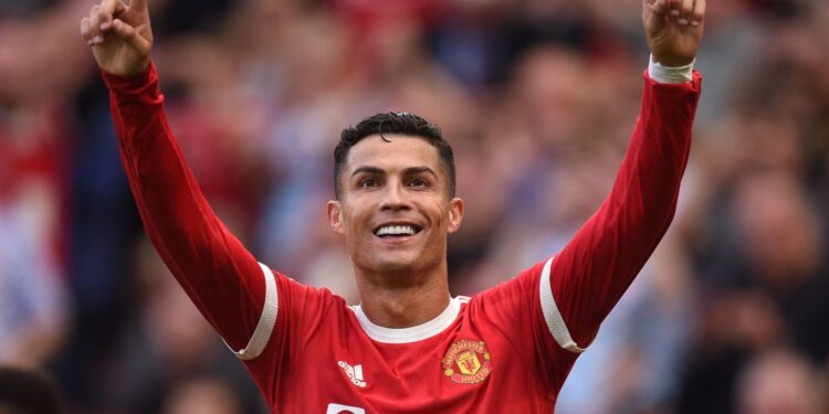 TOPSHOT - Manchester United's Portuguese striker Cristiano Ronaldo celebrates after scoring their second goal during the English Premier League football match between Manchester United and Newcastle at Old Trafford in Manchester, north west England, on September 11, 2021. - RESTRICTED TO EDITORIAL USE. No use with unauthorized audio, video, data, fixture lists, club/league logos or 'live' services. Online in-match use limited to 120 images. An additional 40 images may be used in extra time. No video emulation. Social media in-match use limited to 120 images. An additional 40 images may be used in extra time. No use in betting publications, games or single club/league/player publications. (Photo by Oli SCARFF / AFP) / RESTRICTED TO EDITORIAL USE. No use with unauthorized audio, video, data, fixture lists, club/league logos or 'live' services. Online in-match use limited to 120 images. An additional 40 images may be used in extra time. No video emulation. Social media in-match use limited to 120 images. An additional 40 images may be used in extra time. No use in betting publications, games or single club/league/player publications. / RESTRICTED TO EDITORIAL USE. No use with unauthorized audio, video, data, fixture lists, club/league logos or 'live' services. Online in-match use limited to 120 images. An additional 40 images may be used in extra time. No video emulation. Social media in-match use limited to 120 images. An additional 40 images may be used in extra time. No use in betting publications, games or single club/league/player publications. (Photo by OLI SCARFF/AFP via Getty Images)