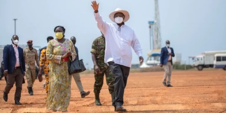 Ugandan President Yoweri Museveni waves at the crowd as he arrives to officially launch the drilling of development and production wells at the Kingfisher development area in Kikuube district, western Uganda, on January 24, 2023. PHOTO: Stuart Tibaweswa/AFP