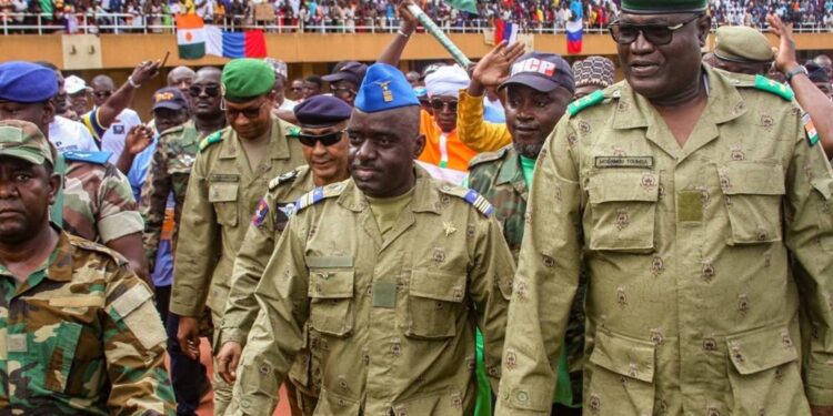 Members of a military council that staged a coup in Niger attend a rally at a stadium in Niamey, Niger, August 6, 2023. REUTERS/Mahamadou Hamidou NO RESALES. NO ARCHIVES