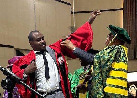 UniUyo Vice Chancellor decorating Vincent Enyeama with the Honourary Doctorate Degree