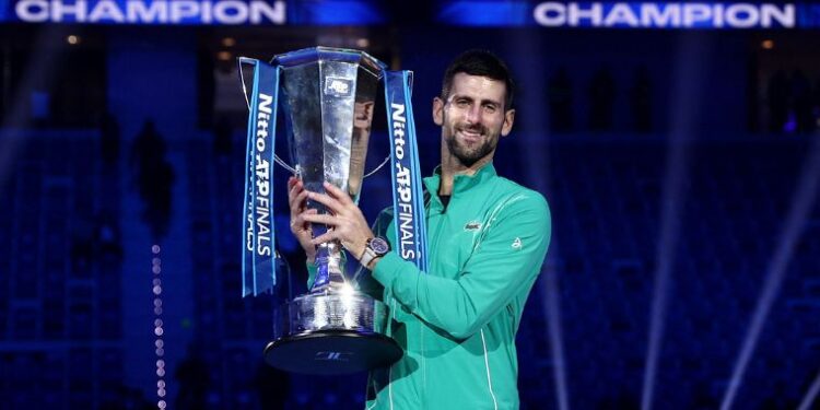 Novak Djokovic celebrates with a trophy after winning the final against Italy's Jannik Sinner | Reuters