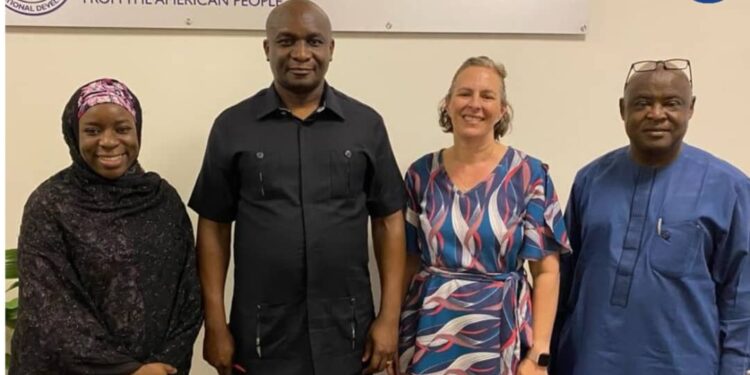 The NDDC Managing Director, Dr Samuel Ogbuku, flanked by Aisha Shehu, Programme Specialist, PDG, USAID (left), Melissa Desai, Deputy Director Peace and Democratic Governance and Machill Maxwell, Governance Specialist, PDG, USAID during a meeting at the United States Embassy in Abuja.