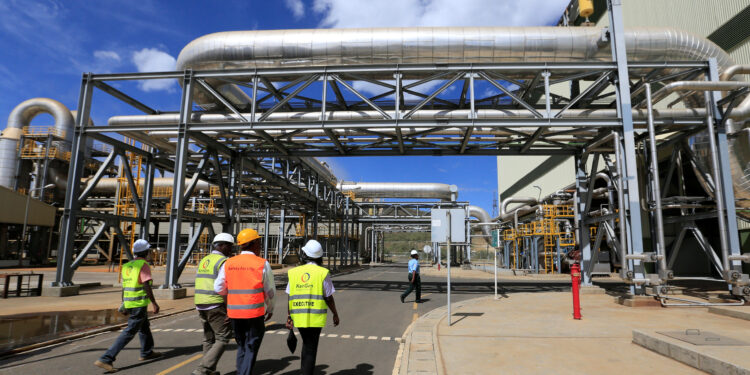 Kenya Electricity Generating Company (KenGen) workers walk at the Olkaria II Geothermal power plant near the Rift Valley town of Naivasha, Kenya February 15, 2018.  REUTERS/Thomas Mukoya