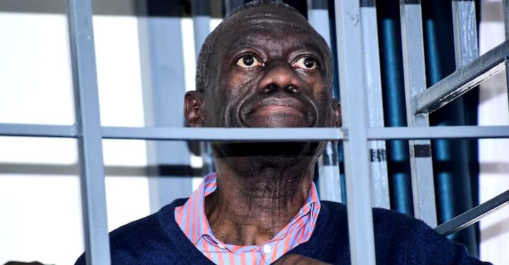 Opposition leader Kizza Besigye stands in a steel dock at the Uganda Military General Court Martial in Makindye, a suburb of Kampala, Uganda December 2, 2024