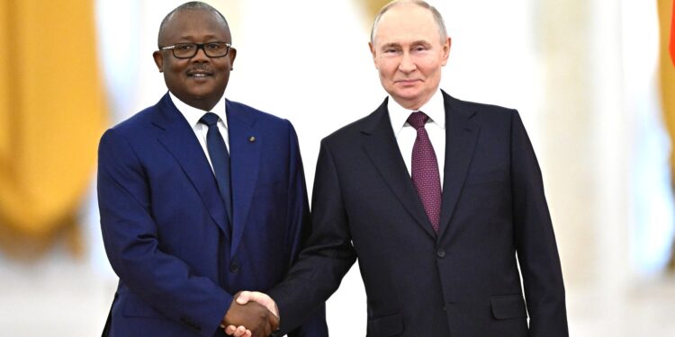 Russian president Vladimir Putin shakes hands with Guinea-Bissau's President Umaro Sissoco Embalo during their meeting at the Kremlin in Moscow, Russia, February 26, 2025.